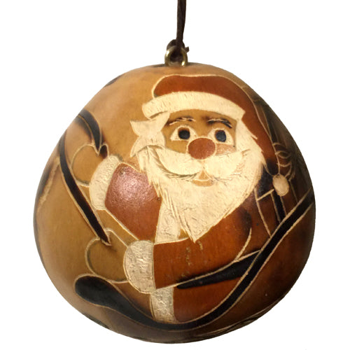 Handcrafted Santa Claus in Sleigh with Reindeer ornament made from natural gourd, showcasing intricate designs by Peruvian artisans.