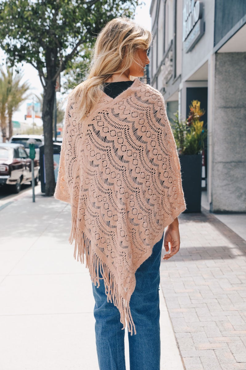 A cozy Scallop Lace Knit Poncho featuring elegant scallop lace details, perfect for chilly days.