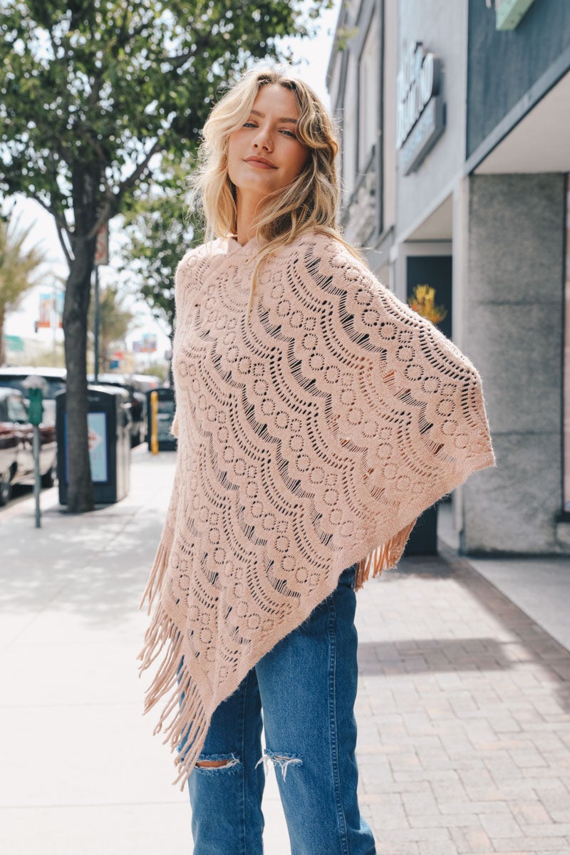 A cozy Scallop Lace Knit Poncho featuring elegant scallop lace details, perfect for chilly days.