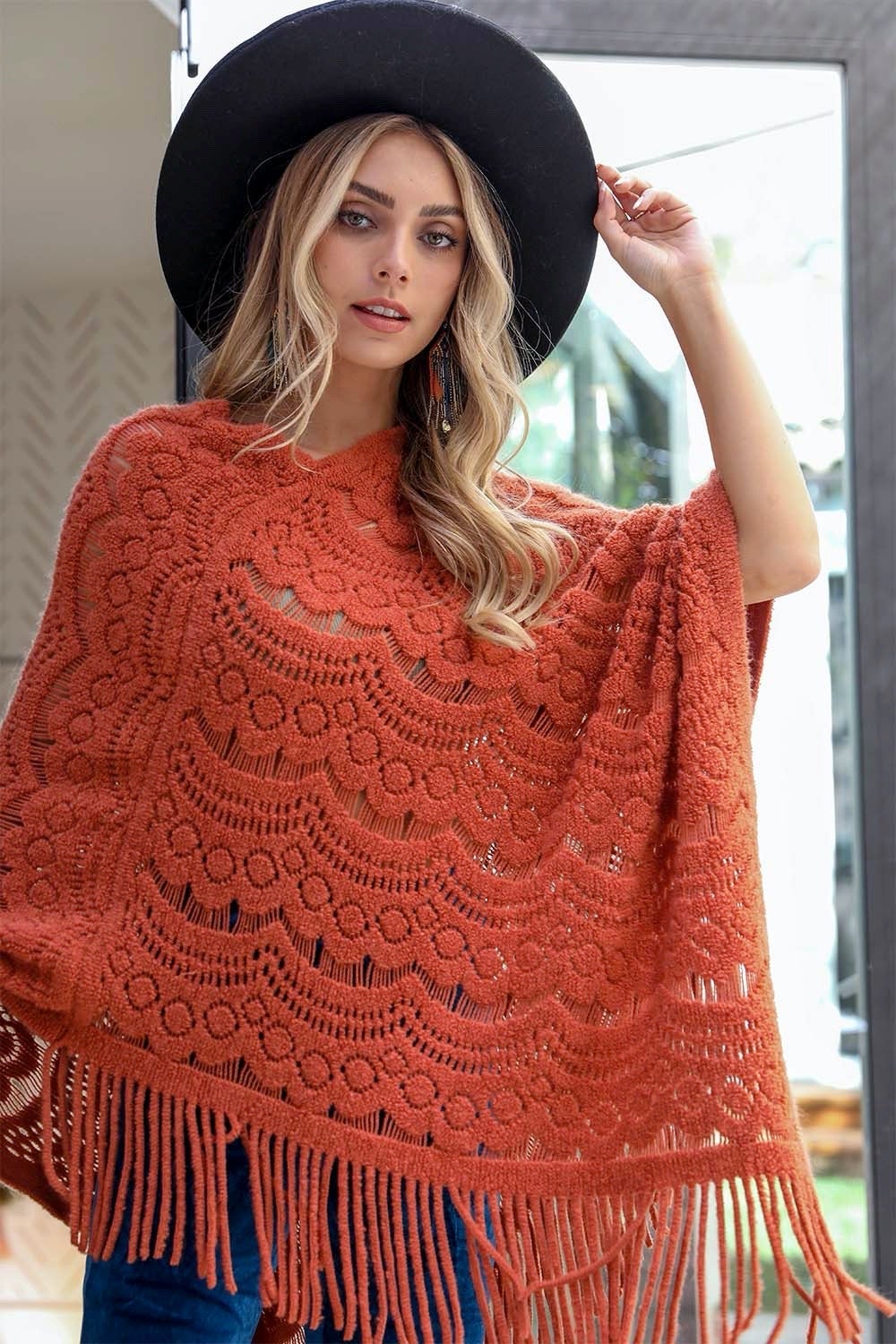 A cozy Scallop Lace Knit Poncho featuring elegant scallop lace details, perfect for chilly days.