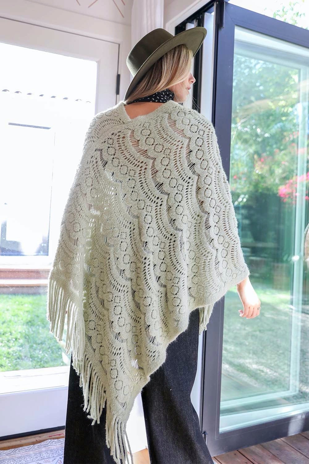 A cozy Scallop Lace Knit Poncho featuring elegant scallop lace details, perfect for chilly days.