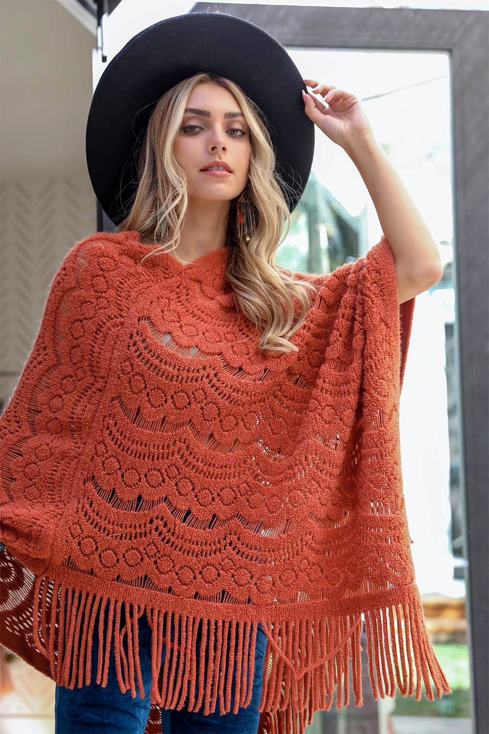 A cozy Scallop Lace Knit Poncho featuring elegant scallop lace details, perfect for chilly days.