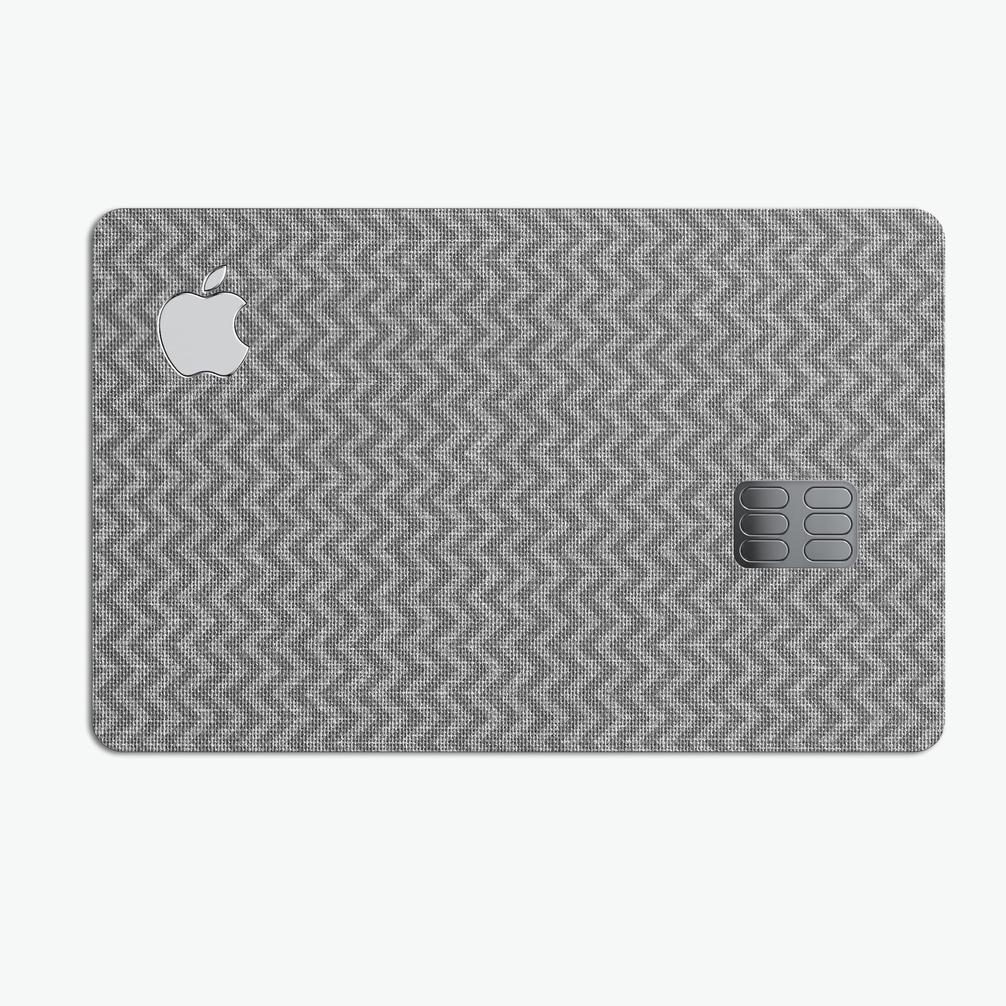 Scratched Chevron Over Gray Fabric decal skin applied to an Apple Card, showcasing its stylish design and premium quality.