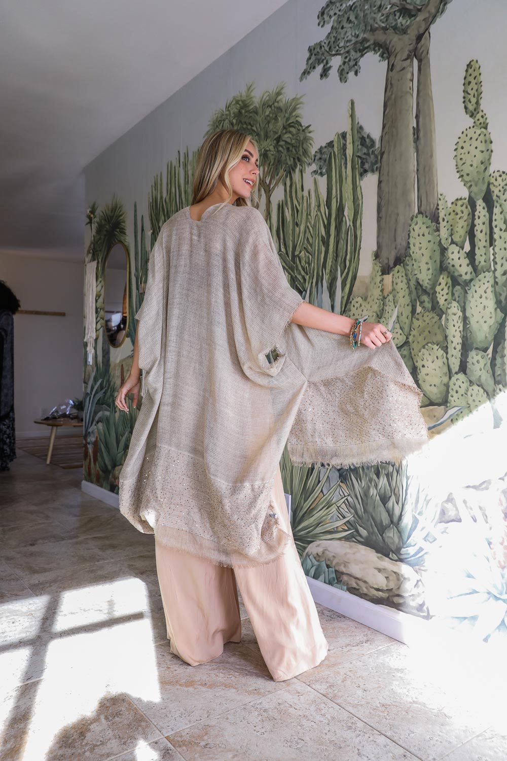 A stylish Sequin Detailed Frayed Kimono featuring shimmering sequins and trendy frayed edges, perfect for versatile styling.