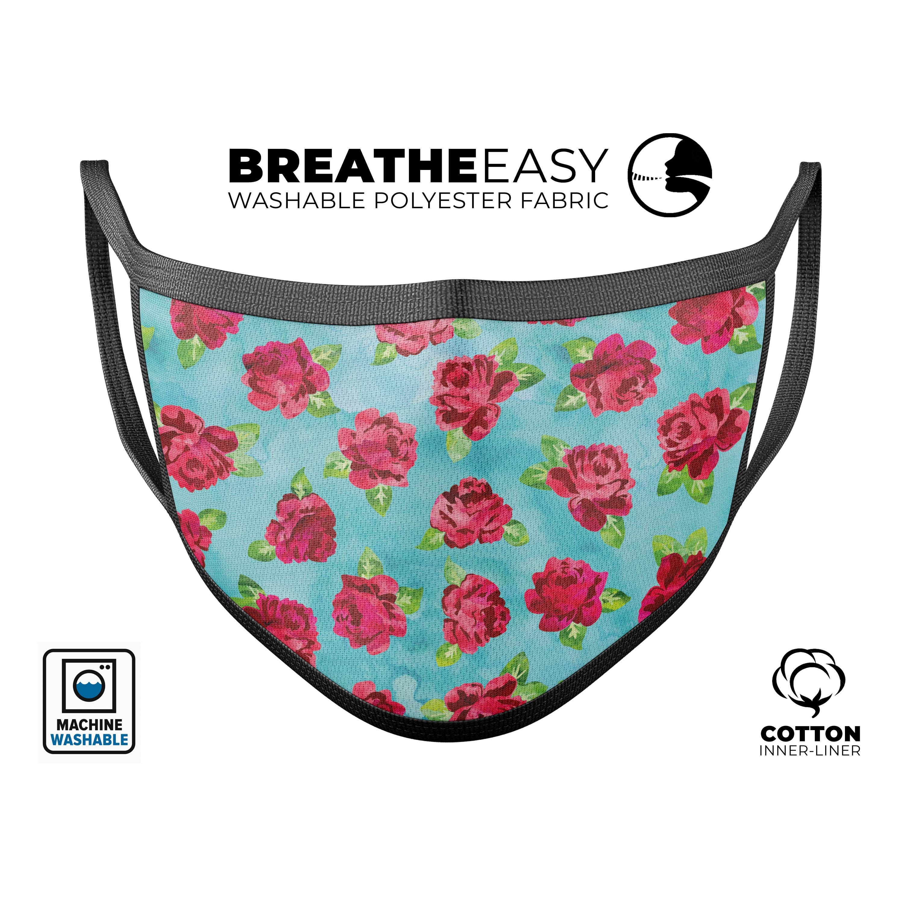 A reusable 3D face mask featuring a shabby chic floral design over an aqua watercolor background, made in the USA.