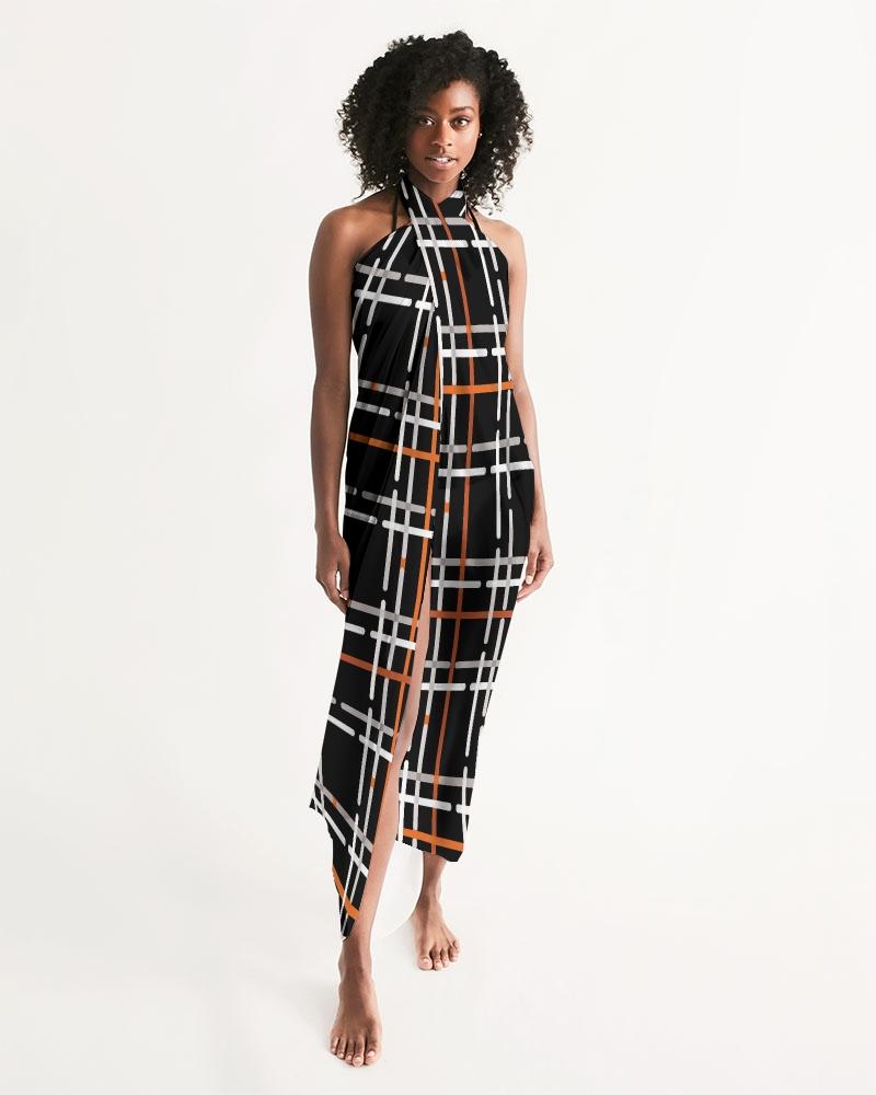 Sheer Sarong Swimsuit Cover Up in Black and Orange Plaid, showcasing its lightweight fabric and stylish design.