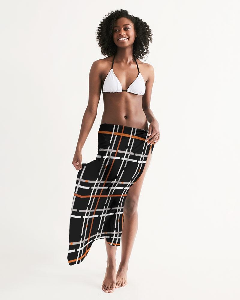 Sheer Sarong Swimsuit Cover Up in Black and Orange Plaid, showcasing its lightweight fabric and stylish design.