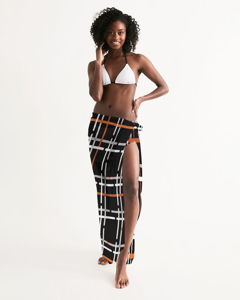 Sheer Sarong Swimsuit Cover Up in Black and Orange Plaid, showcasing its lightweight fabric and stylish design.