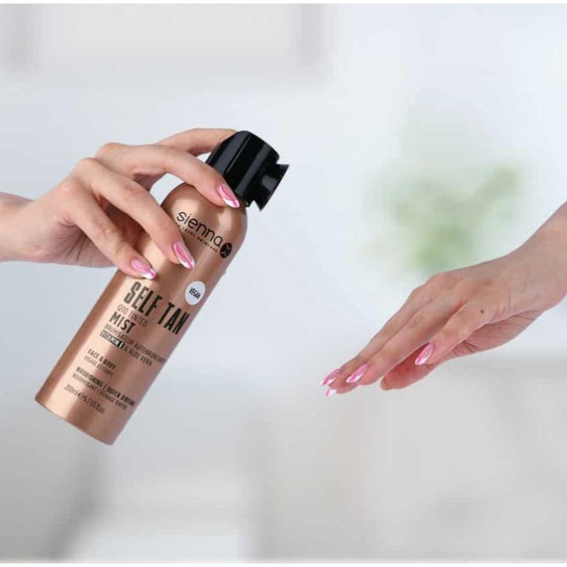 Sienna X Q10 Tinted Mist spray bottle with a luxurious design, showcasing its medium to deep self-tanning capabilities.