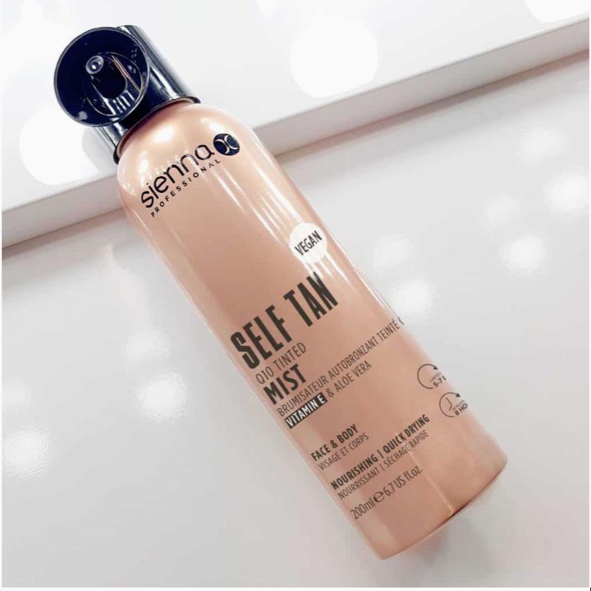 Sienna X Q10 Tinted Mist spray bottle with a luxurious design, showcasing its medium to deep self-tanning capabilities.