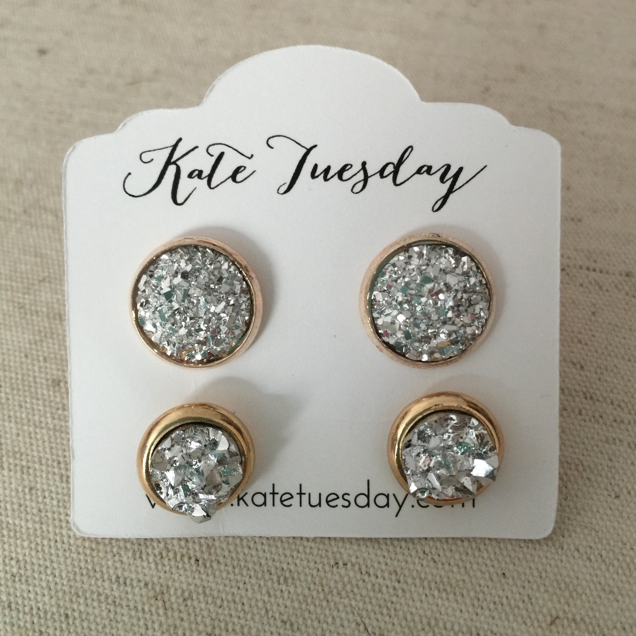 A pair of Silver Babes Druzy Earrings Set featuring 8mm and 12mm silver sparkle earrings, elegantly displayed with earring backs.