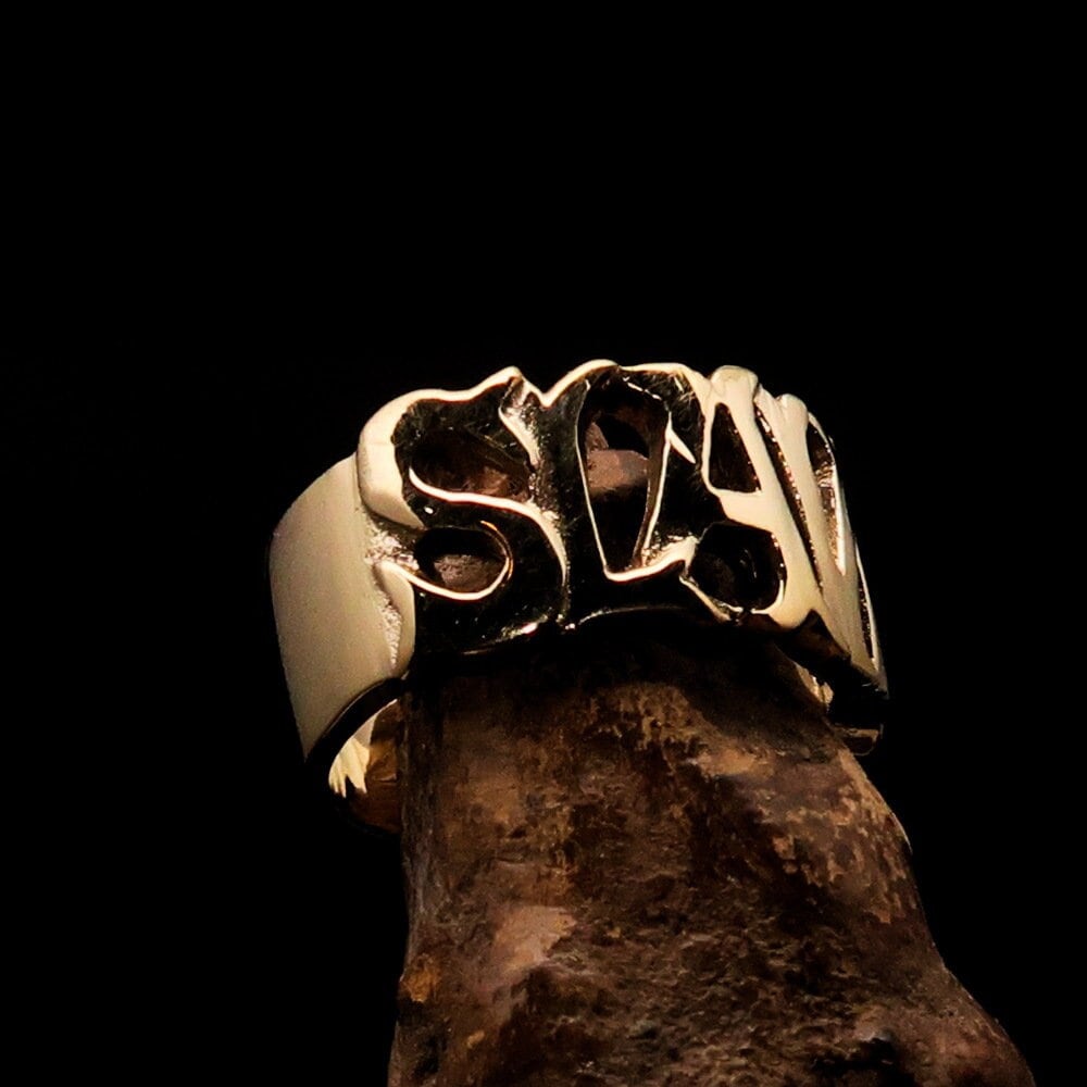 Solid brass slave ring featuring bold 'SLAVE' lettering with a mirror-polished finish, designed for a modern and stylish look.