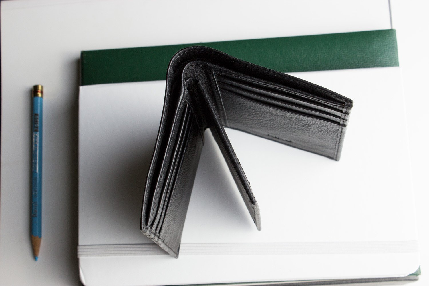 Slimfold Passcase Wallet made of butter soft full grain cowhide leather, featuring 6 card slots and a removable ID case.