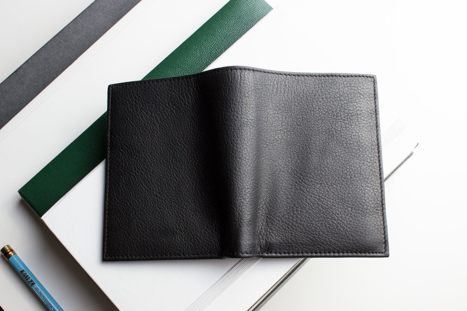 Slimfold Passcase Wallet made of butter soft full grain cowhide leather, featuring 6 card slots and a removable ID case.