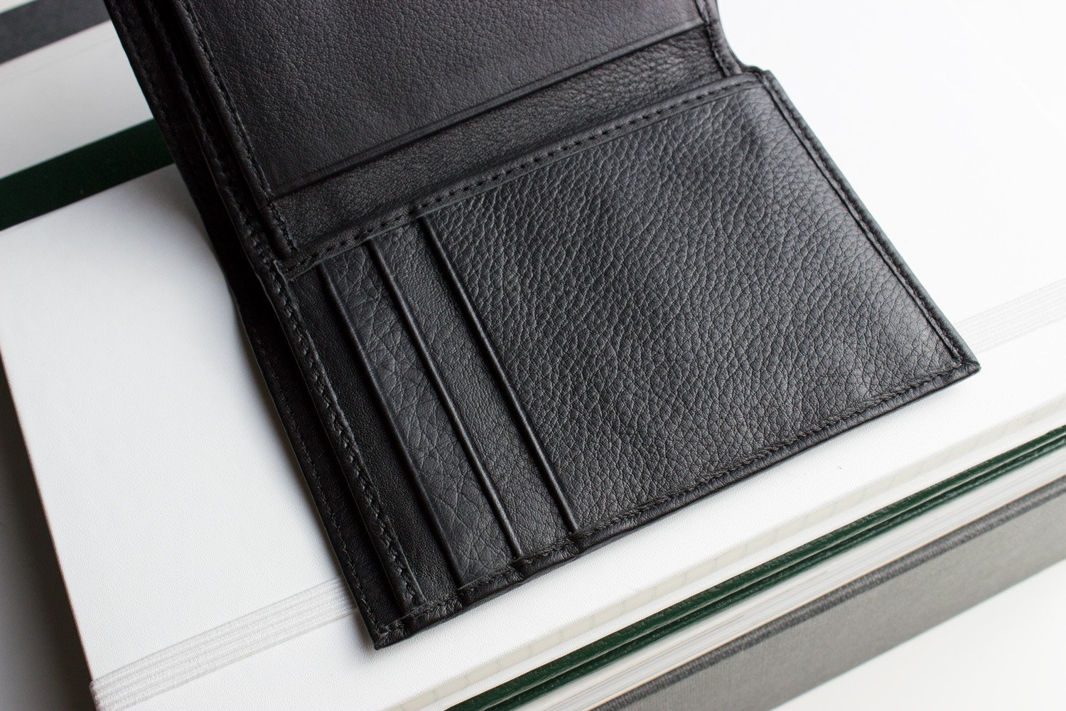 Slimfold Passcase Wallet made of butter soft full grain cowhide leather, featuring 6 card slots and a removable ID case.