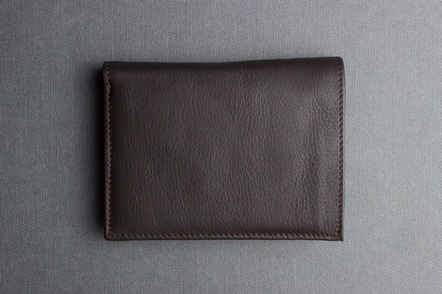 Slimfold Passcase Wallet made of butter soft full grain cowhide leather, featuring 6 card slots and a removable ID case.