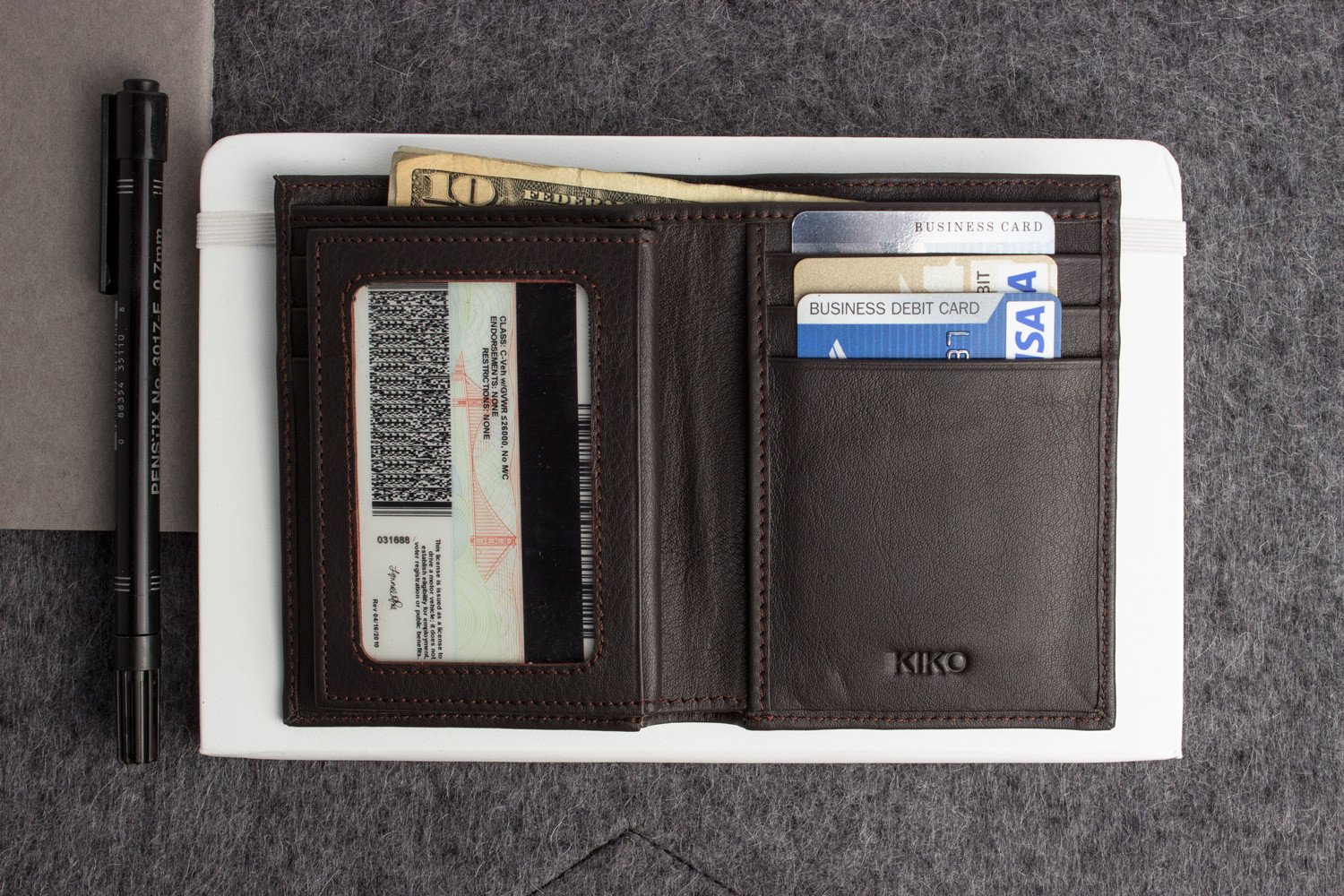 Slimfold Passcase Wallet made of butter soft full grain cowhide leather, featuring 6 card slots and a removable ID case.