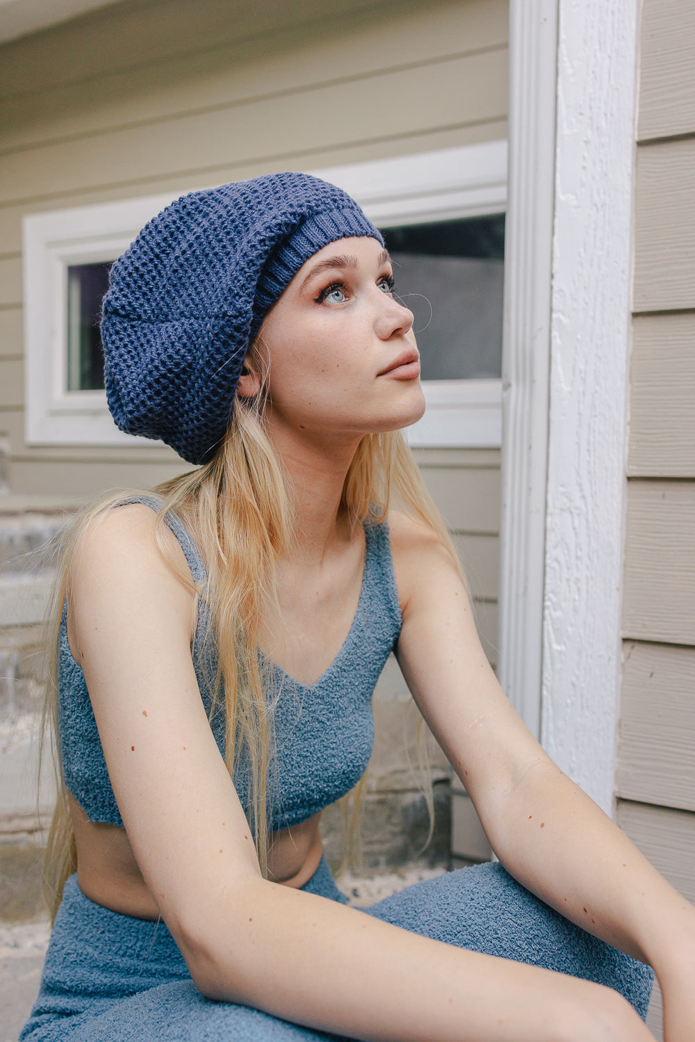 A cozy Slouch Waffle Knit Beanie in various colors, showcasing its soft texture and slouchy fit, perfect for winter wear.