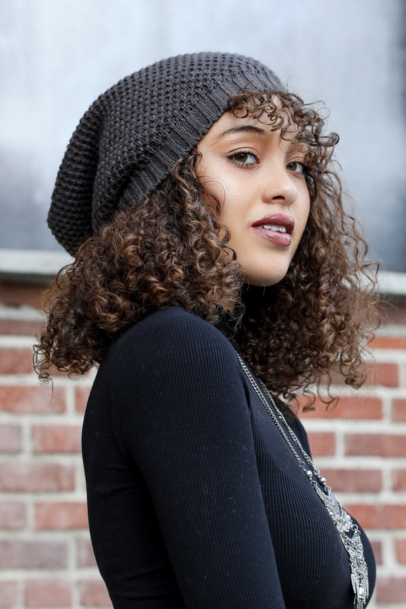 A cozy Slouch Waffle Knit Beanie in various colors, showcasing its soft texture and slouchy fit, perfect for winter wear.