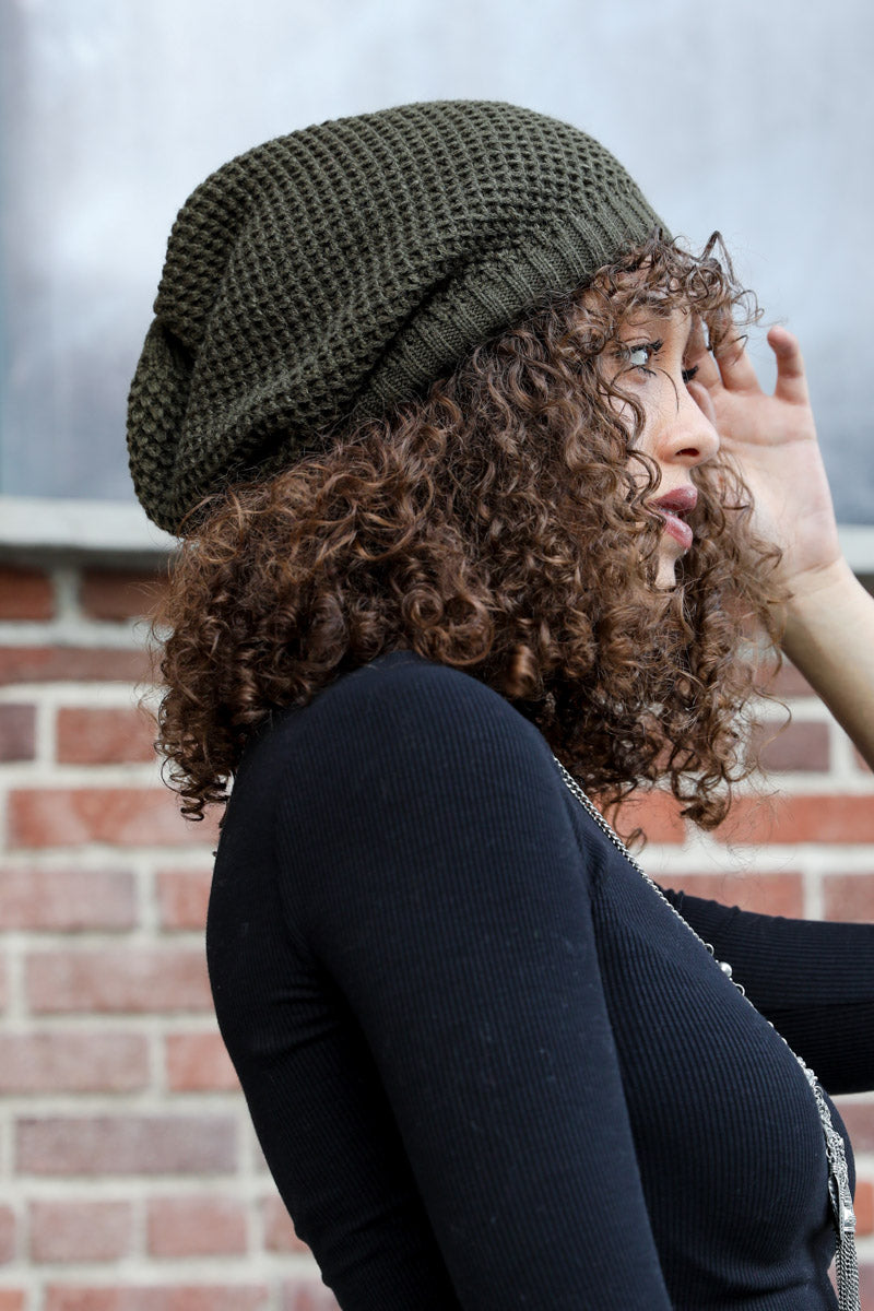 A cozy Slouch Waffle Knit Beanie in various colors, showcasing its soft texture and slouchy fit, perfect for winter wear.