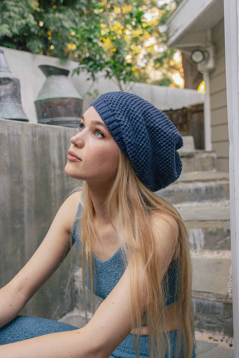 A cozy Slouch Waffle Knit Beanie in various colors, showcasing its soft texture and slouchy fit, perfect for winter wear.