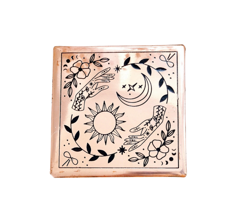 A handmade small copper charging plate with an etched design, measuring 4.5 inches by 4.5 inches, perfect for charging crystals and cleansing energy.