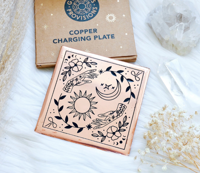 A handmade small copper charging plate with an etched design, measuring 4.5 inches by 4.5 inches, perfect for charging crystals and cleansing energy.