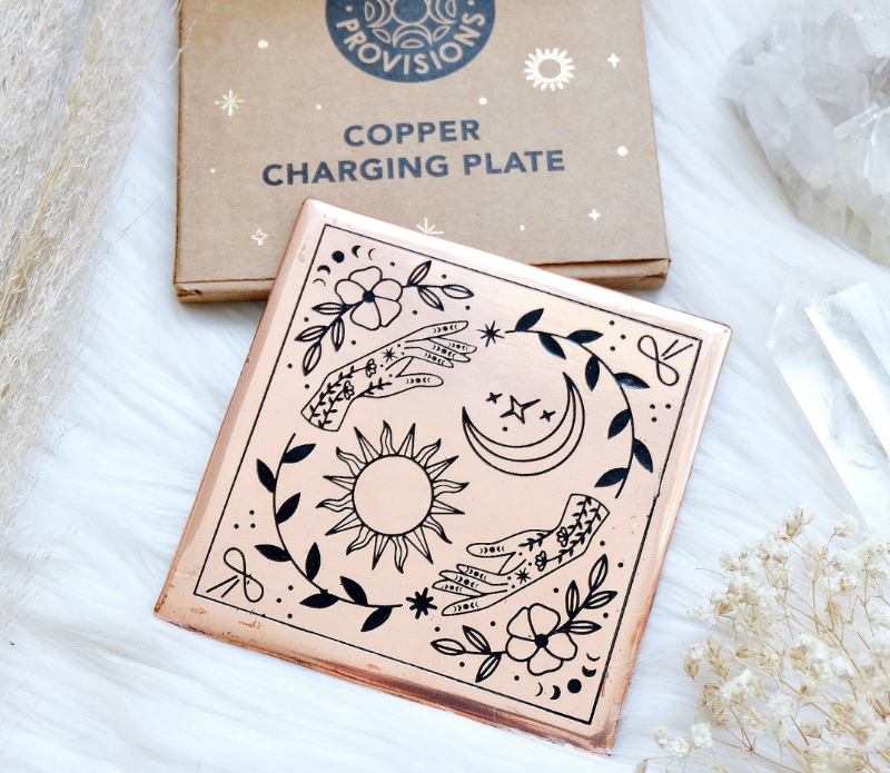 A handmade small copper charging plate with an etched design, measuring 4.5 inches by 4.5 inches, perfect for charging crystals and cleansing energy.