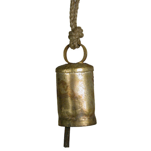 A small cylindrical metal bell handcrafted from recycled scrap metals, showcasing a rustic finish and intricate design.