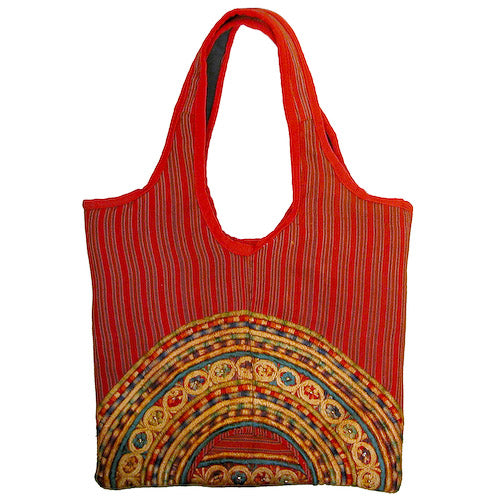 Small Joyabaj Handbag handcrafted from colorful Guatemalan huipils, showcasing unique patterns and vibrant colors.