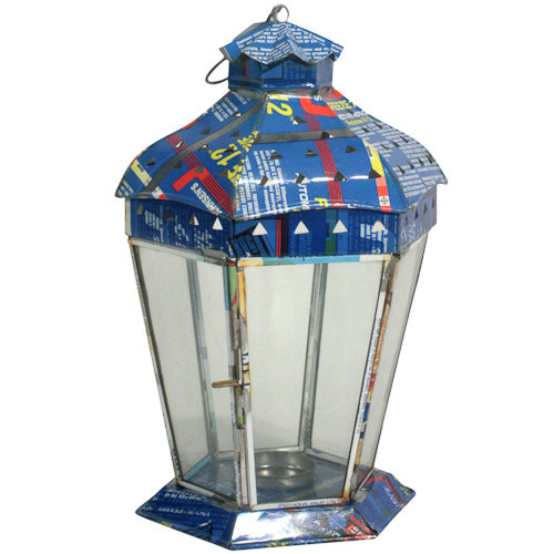 Small recycled metal candle lantern with six sides, handmade in India, showcasing vibrant colors and intricate design.