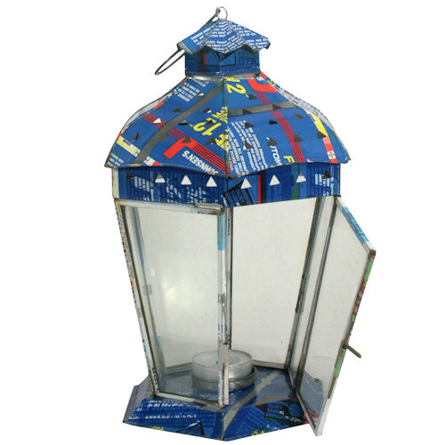 Small recycled metal candle lantern with six sides, handmade in India, showcasing vibrant colors and intricate design.