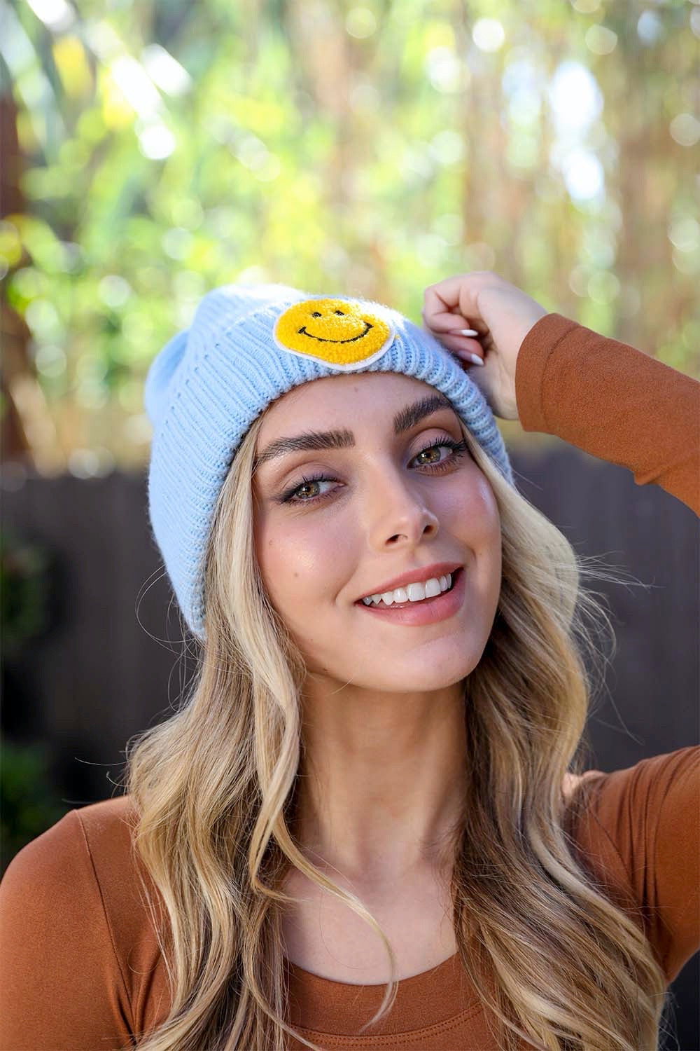 A cozy Smiley Face Ribbed Beanie in soft fabric featuring a cheerful smiley face design, perfect for winter wear.