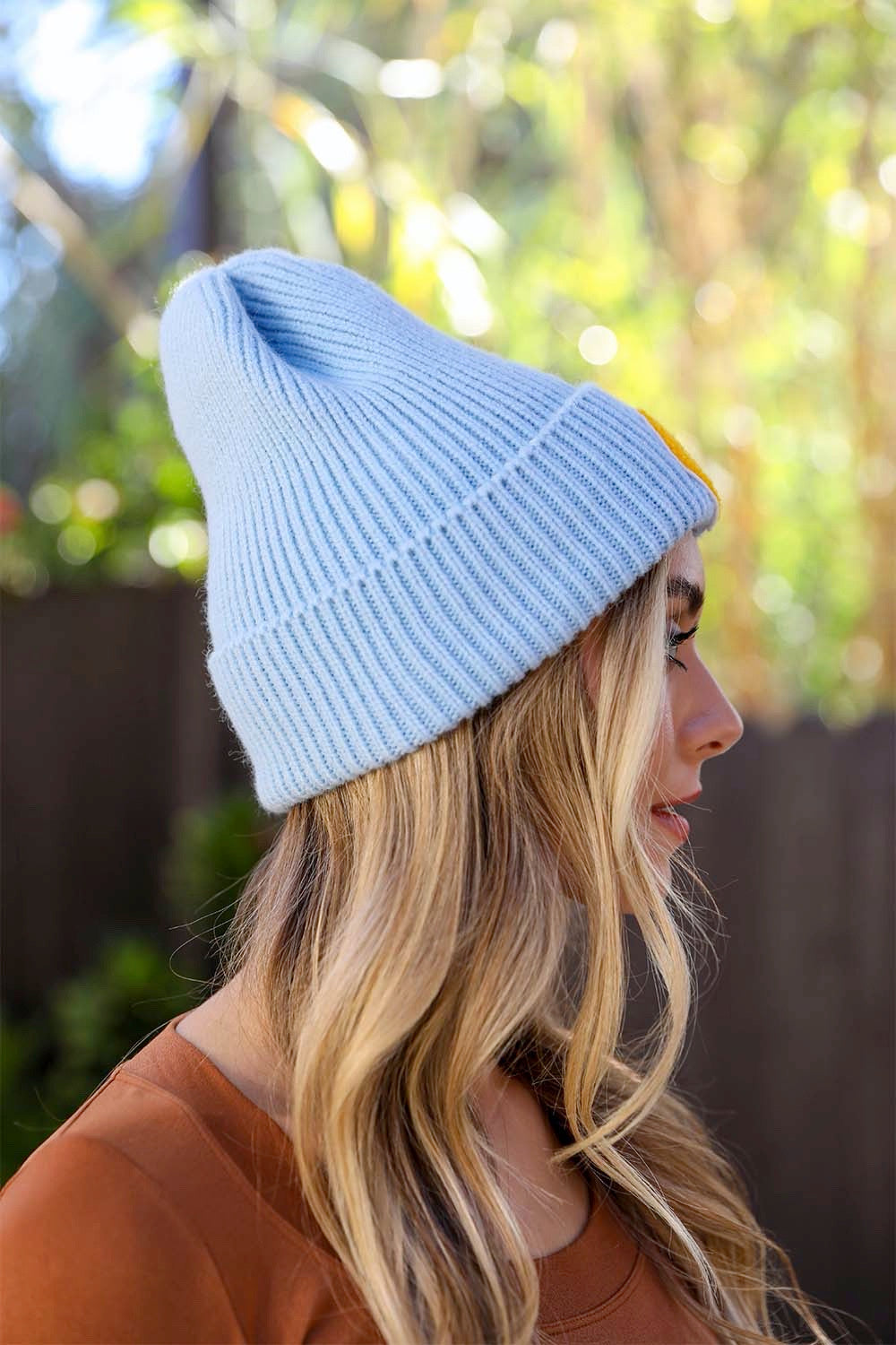 A cozy Smiley Face Ribbed Beanie in soft fabric featuring a cheerful smiley face design, perfect for winter wear.