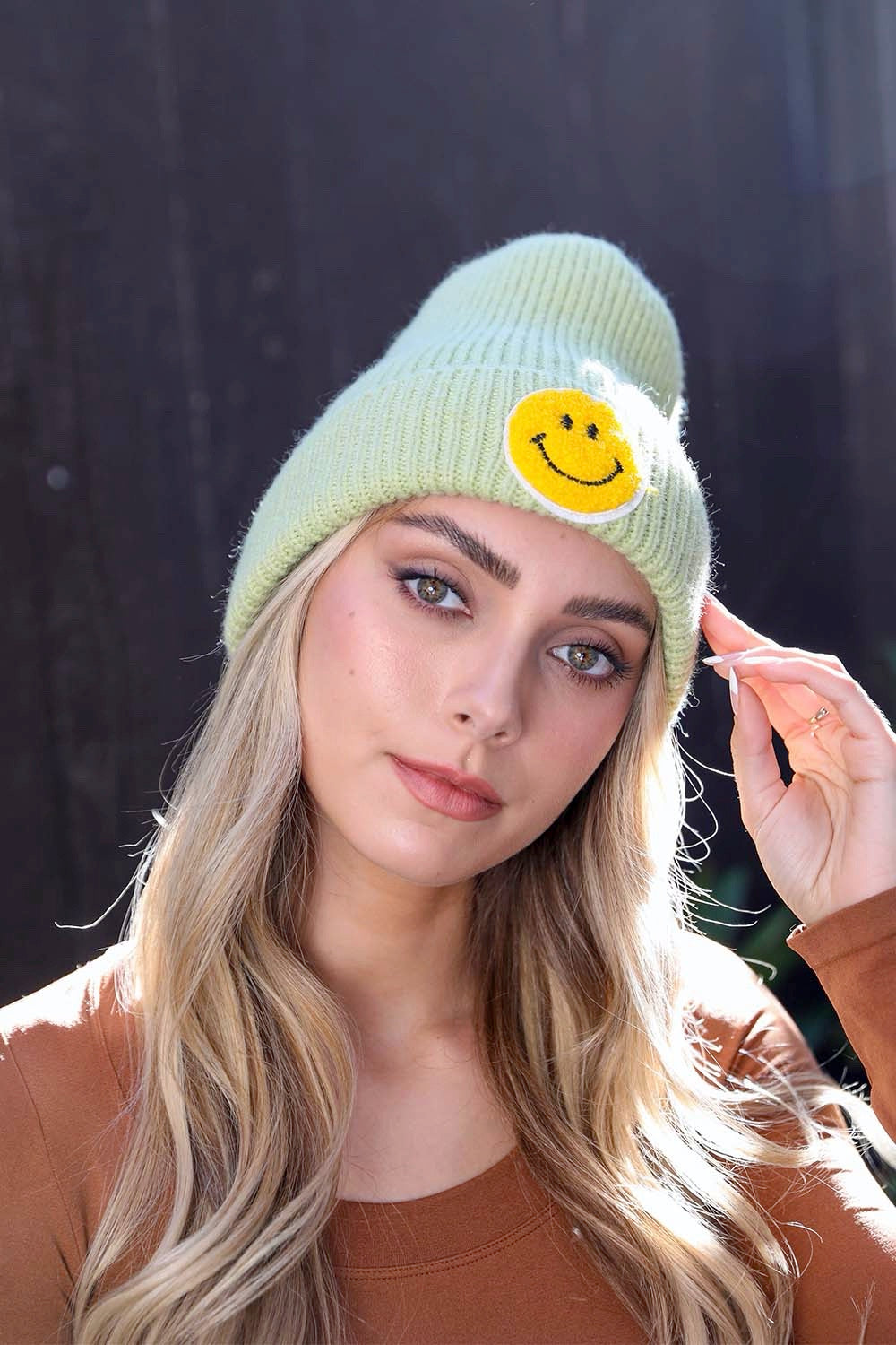 A cozy Smiley Face Ribbed Beanie in soft fabric featuring a cheerful smiley face design, perfect for winter wear.