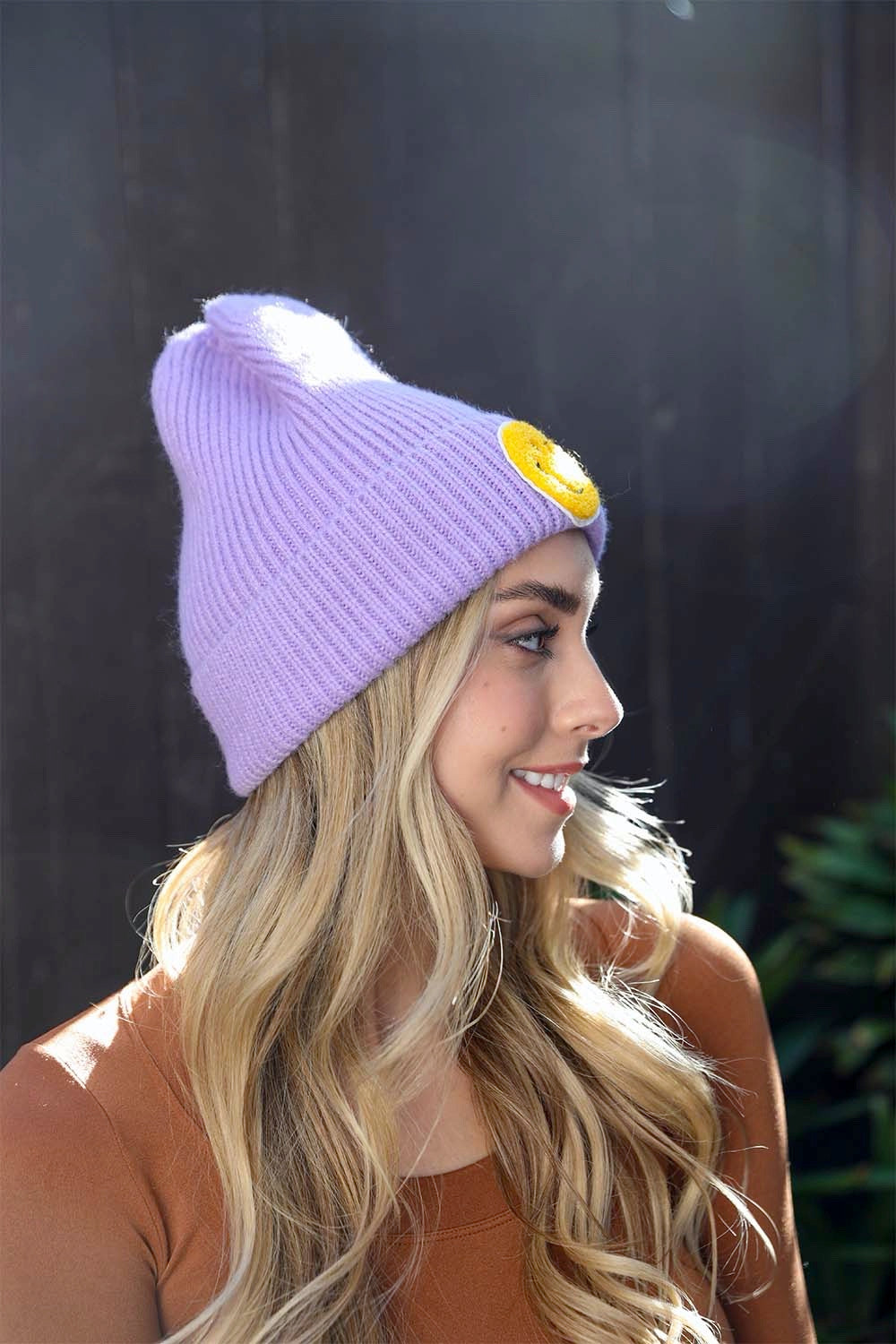 A cozy Smiley Face Ribbed Beanie in soft fabric featuring a cheerful smiley face design, perfect for winter wear.