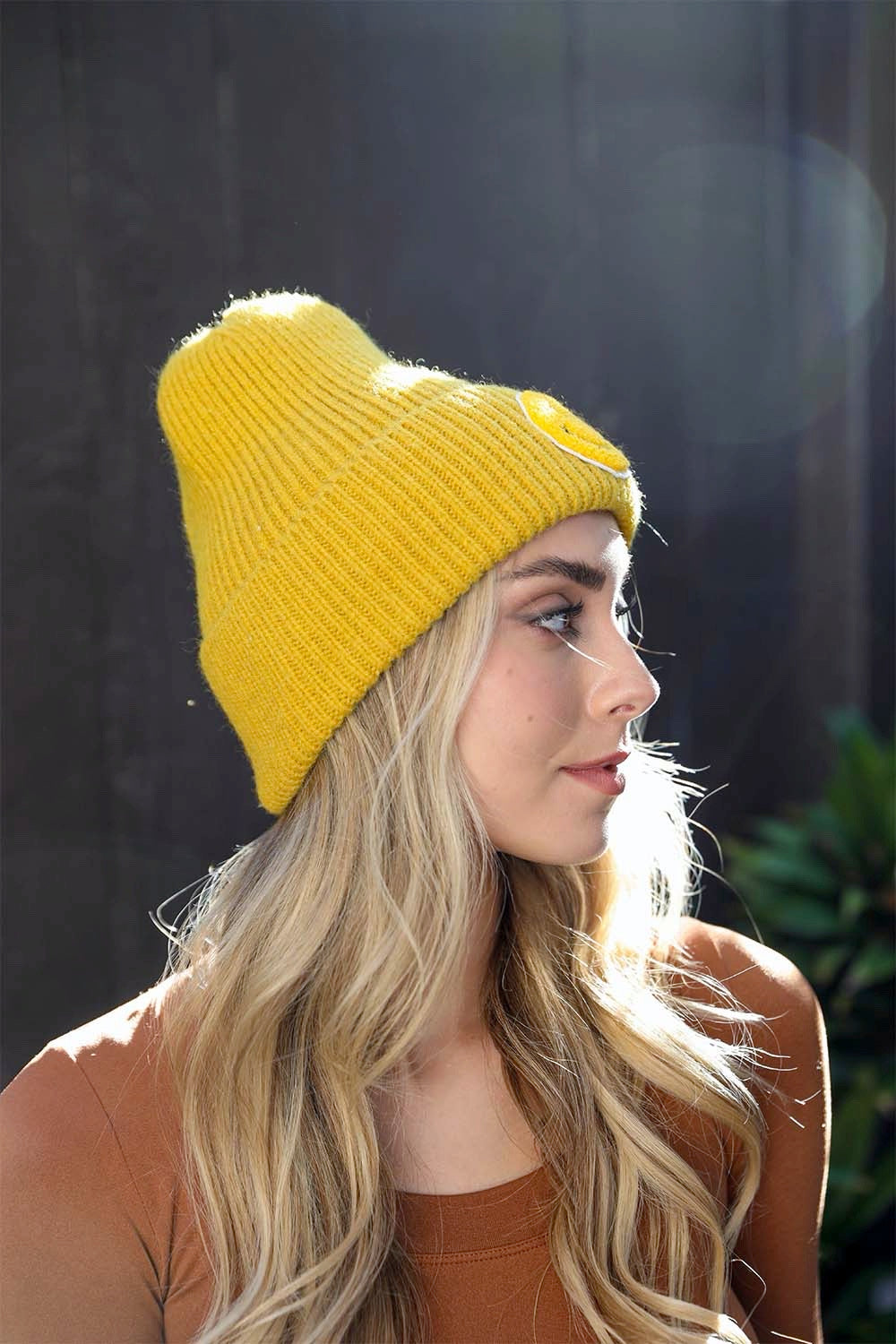 A cozy Smiley Face Ribbed Beanie in soft fabric featuring a cheerful smiley face design, perfect for winter wear.