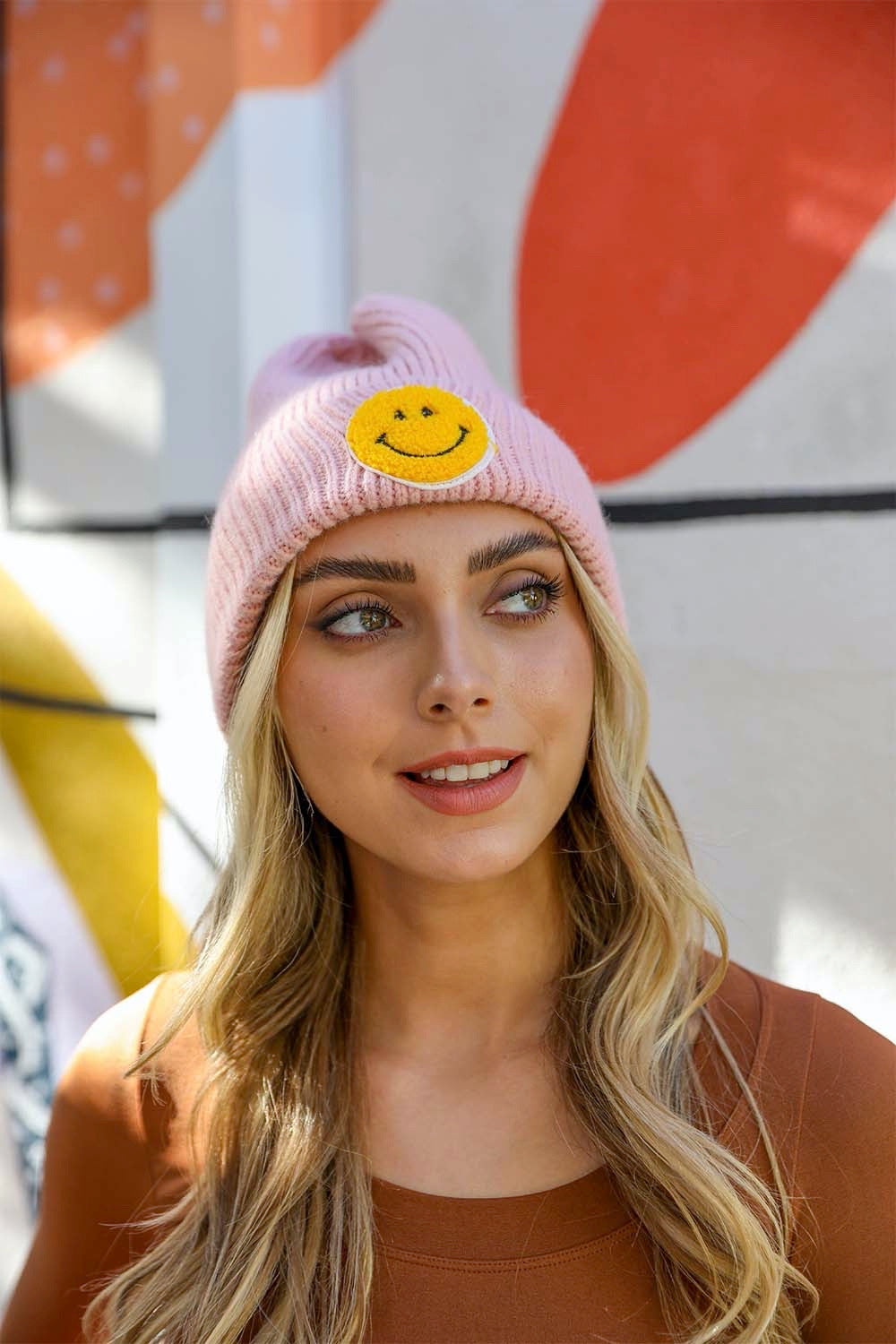 A cozy Smiley Face Ribbed Beanie in soft fabric featuring a cheerful smiley face design, perfect for winter wear.