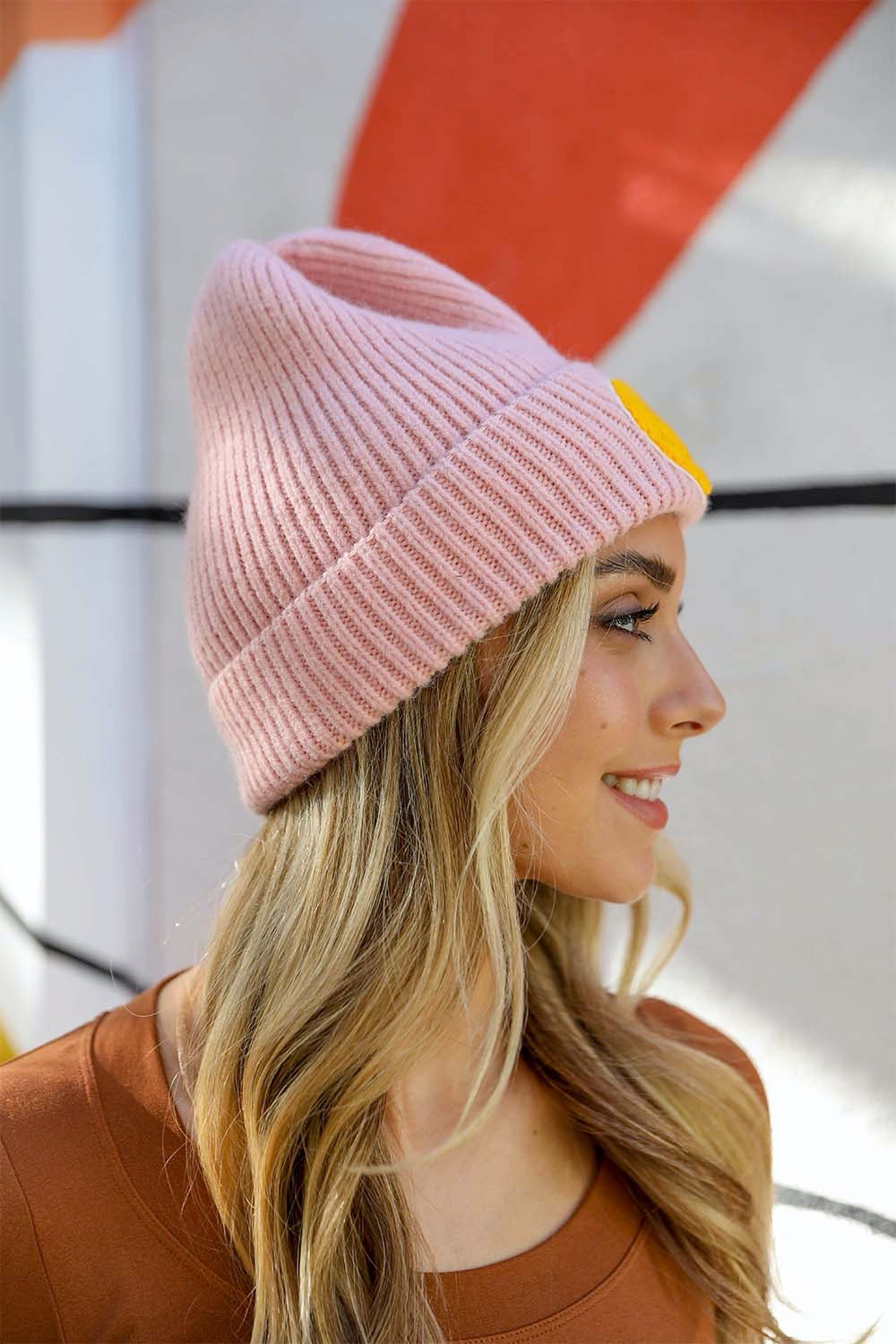 A cozy Smiley Face Ribbed Beanie in soft fabric featuring a cheerful smiley face design, perfect for winter wear.