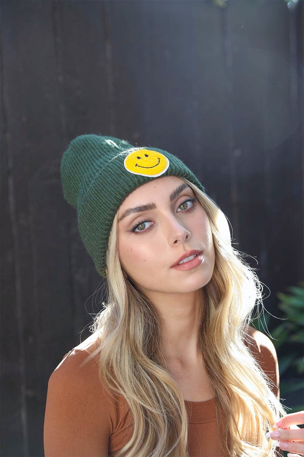 A cozy Smiley Face Ribbed Beanie in soft fabric featuring a cheerful smiley face design, perfect for winter wear.