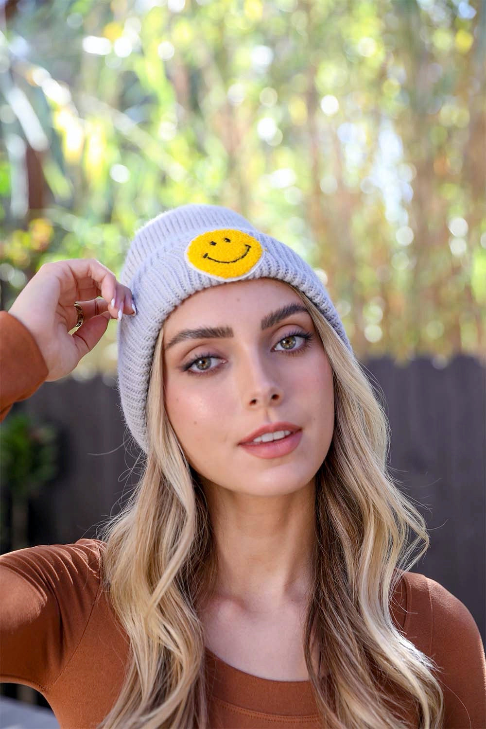 A cozy Smiley Face Ribbed Beanie in soft fabric featuring a cheerful smiley face design, perfect for winter wear.