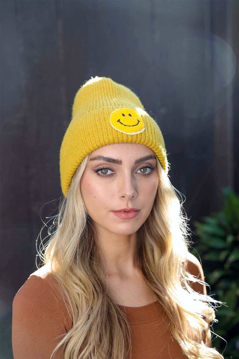 A cozy Smiley Face Ribbed Beanie in soft fabric featuring a cheerful smiley face design, perfect for winter wear.