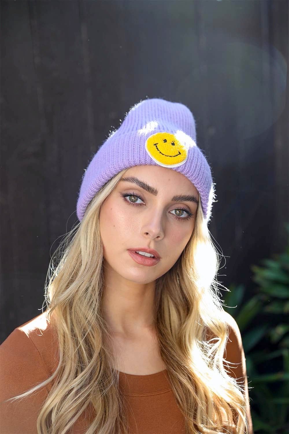 A cozy Smiley Face Ribbed Beanie in soft fabric featuring a cheerful smiley face design, perfect for winter wear.