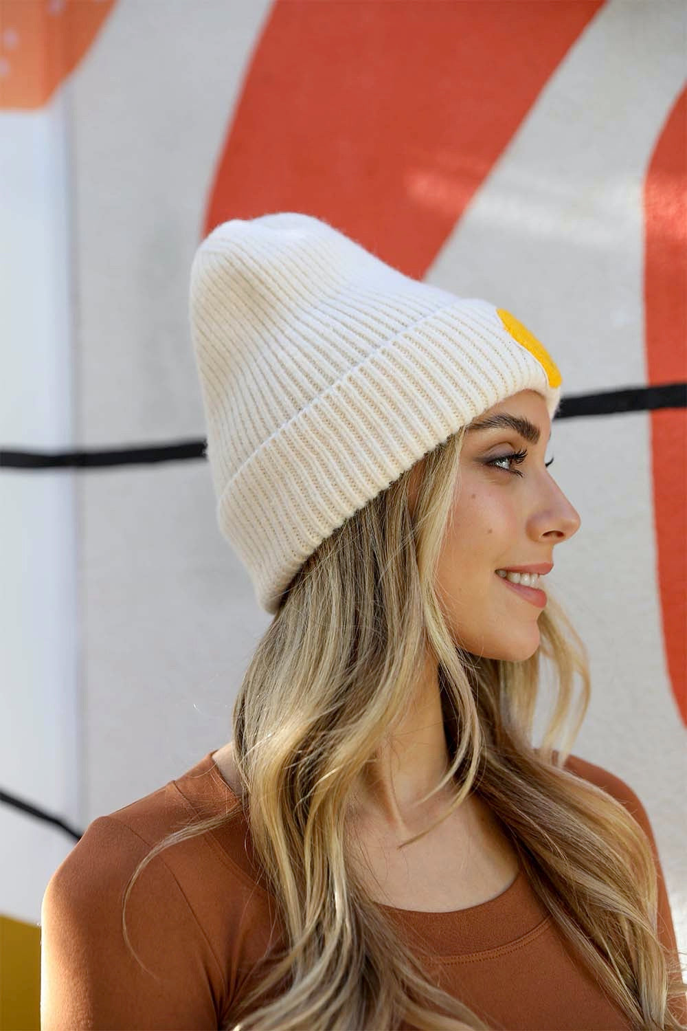 A cozy Smiley Face Ribbed Beanie in soft fabric featuring a cheerful smiley face design, perfect for winter wear.