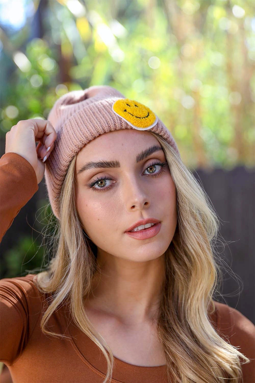 A cozy Smiley Face Ribbed Beanie in soft fabric featuring a cheerful smiley face design, perfect for winter wear.