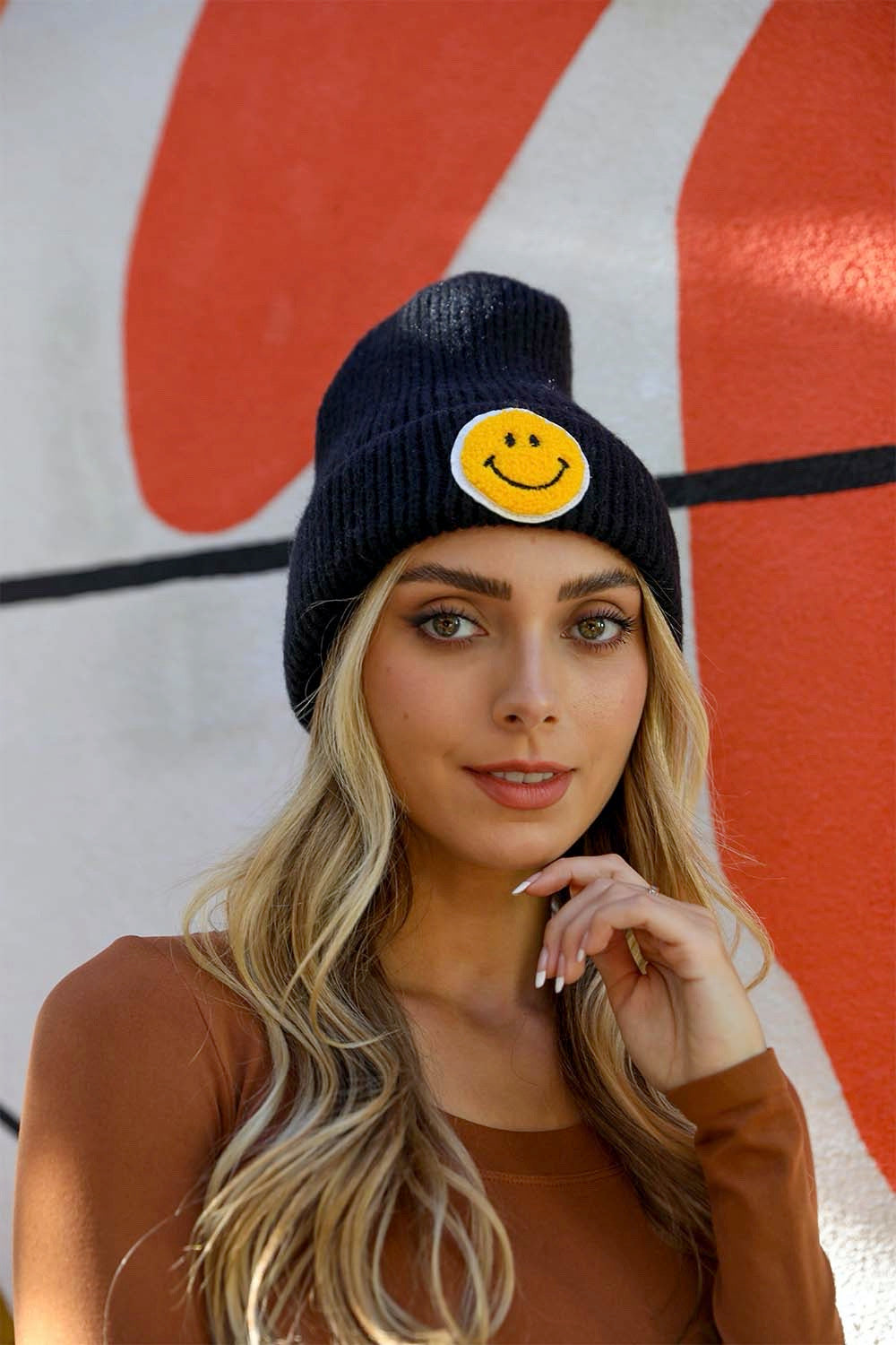 A cozy Smiley Face Ribbed Beanie in soft fabric featuring a cheerful smiley face design, perfect for winter wear.