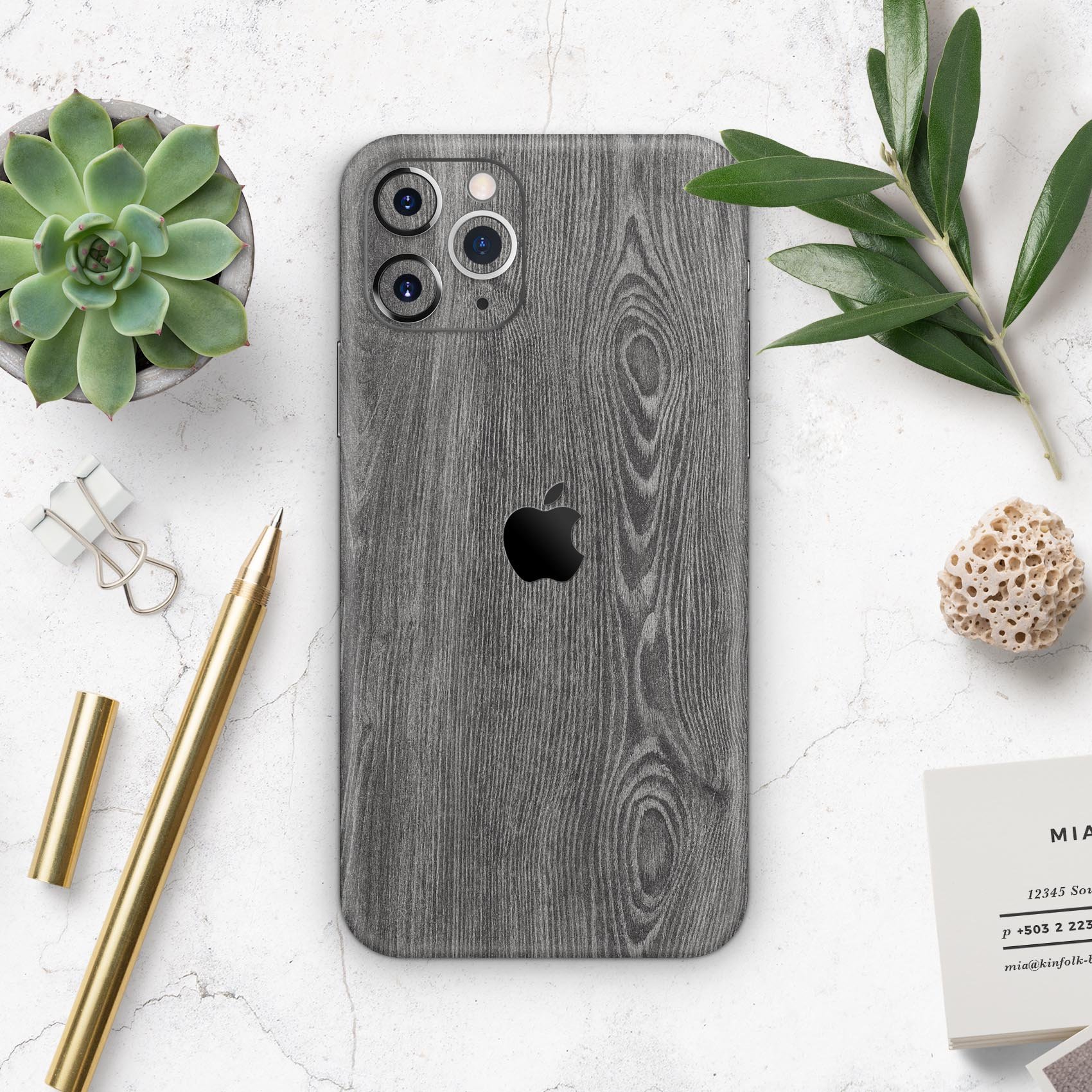 Smooth Gray Wood V2 Skin-Kit for Apple iPhone 14, showcasing a stylish wood grain design.