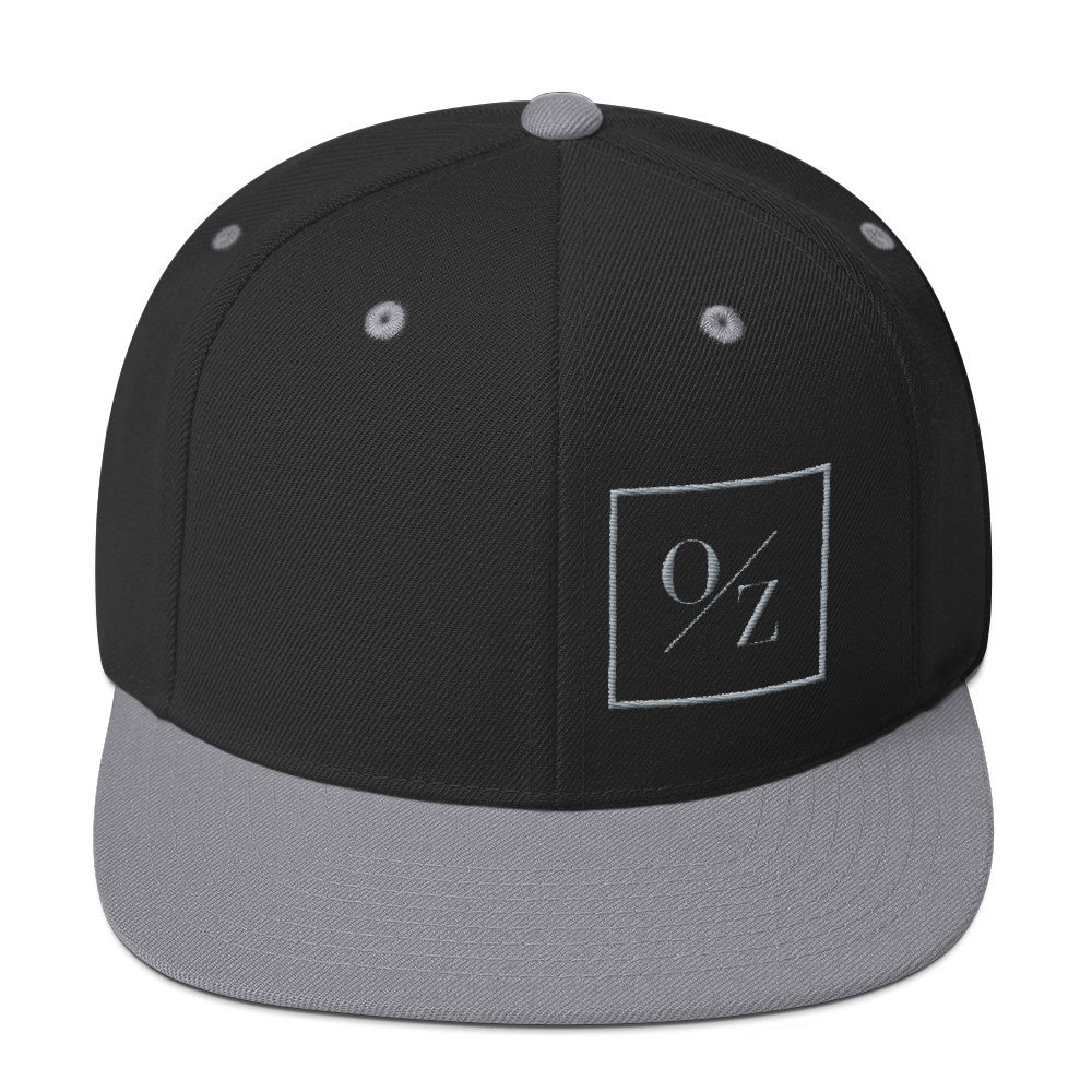 A stylish Snapback Hat with a flat brim, structured design, and puff embroidered O/Z logo on the front.