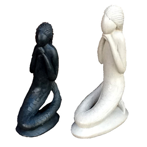 Hand-carved soapstone mermaid sculptures in white and gray, showcasing intricate details and craftsmanship.