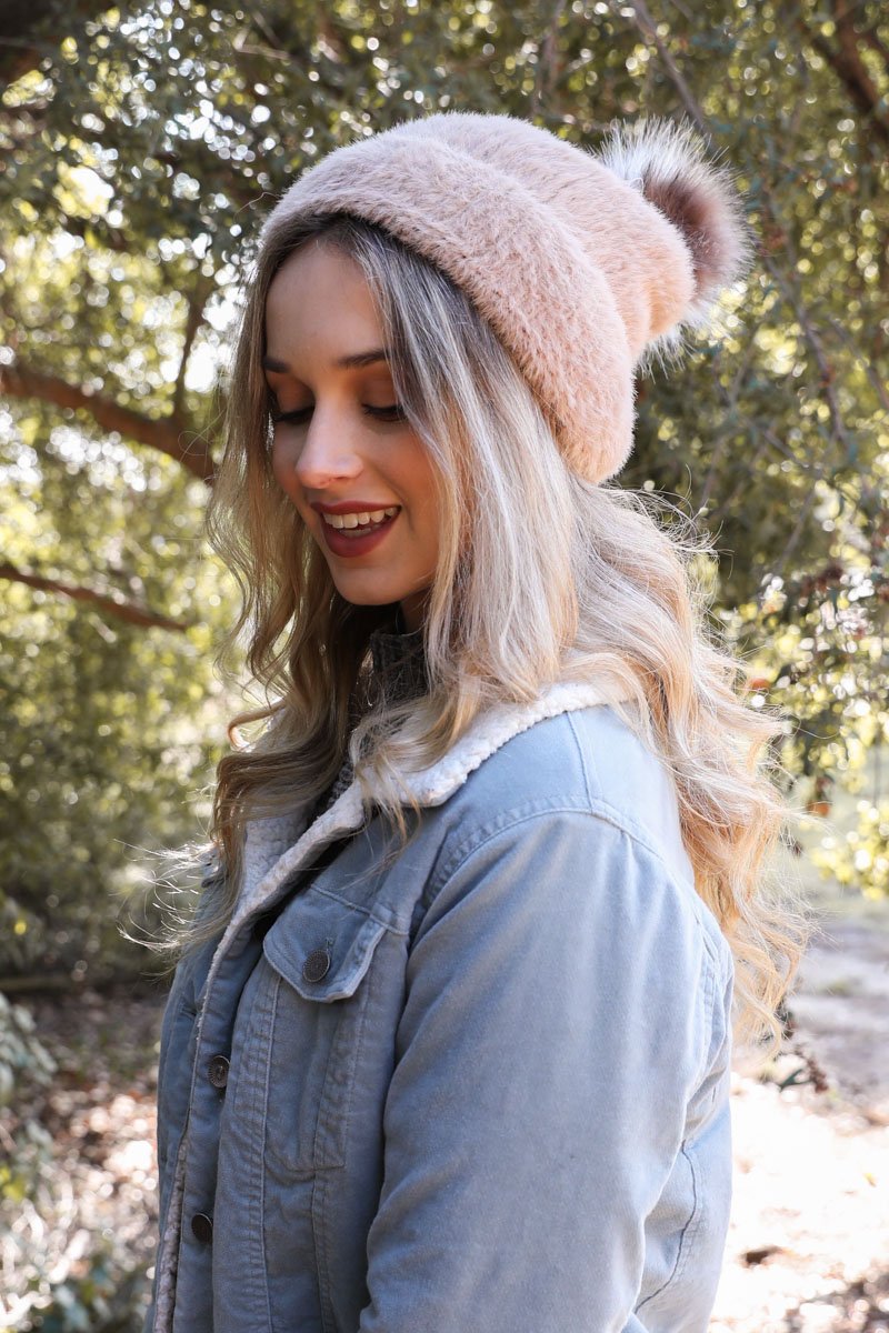 Soft Mohair Pom Beanie in a cozy winter setting, featuring a stylish pom on top and soft faux mohair fabric.